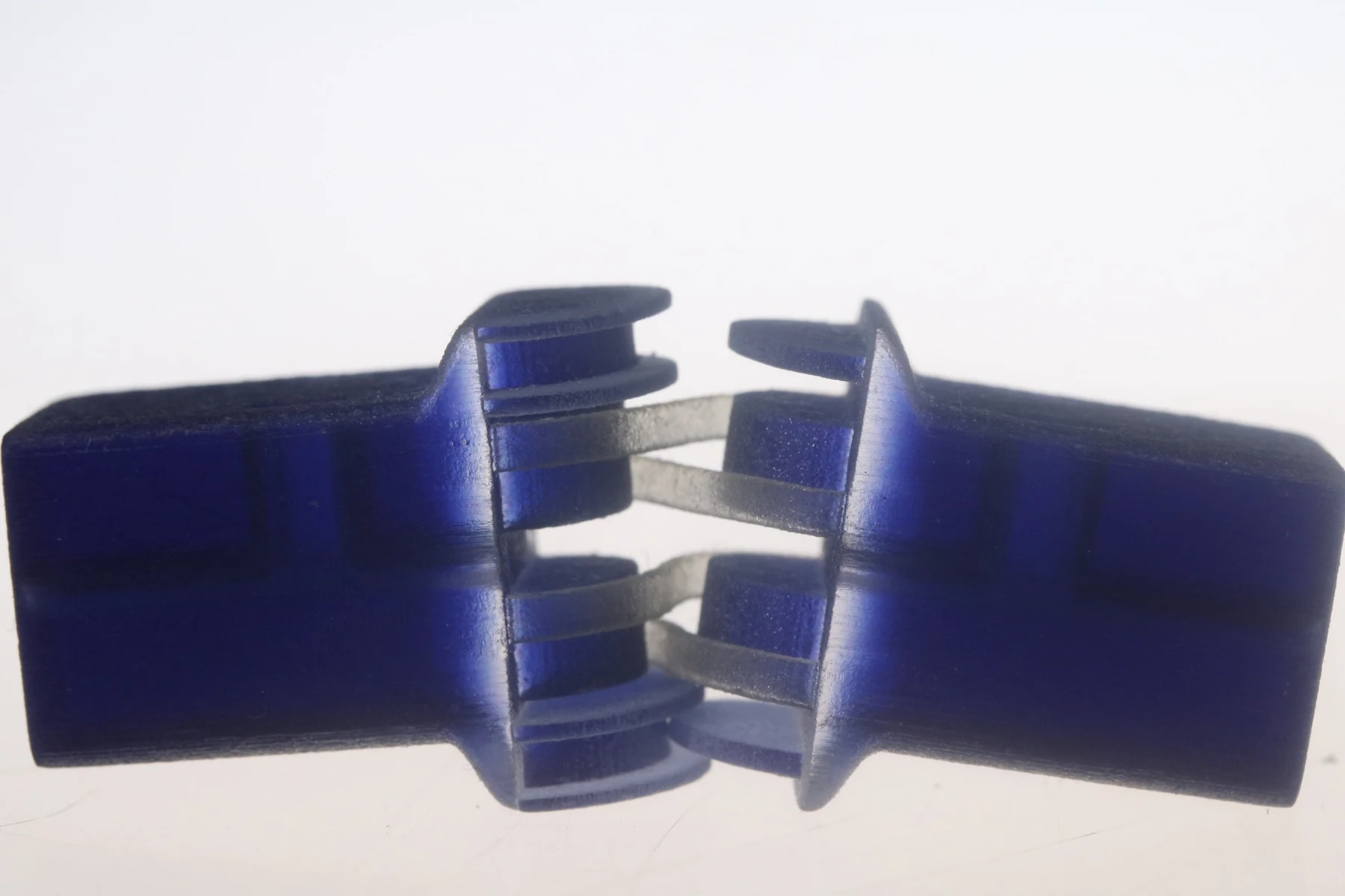 Close-up of a blue printed joint with translucent connecting elements